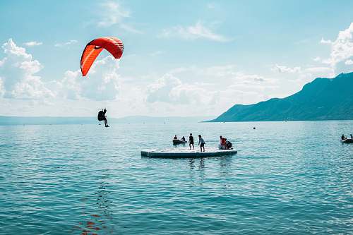 adventure person doing paragliding during daytime gliding